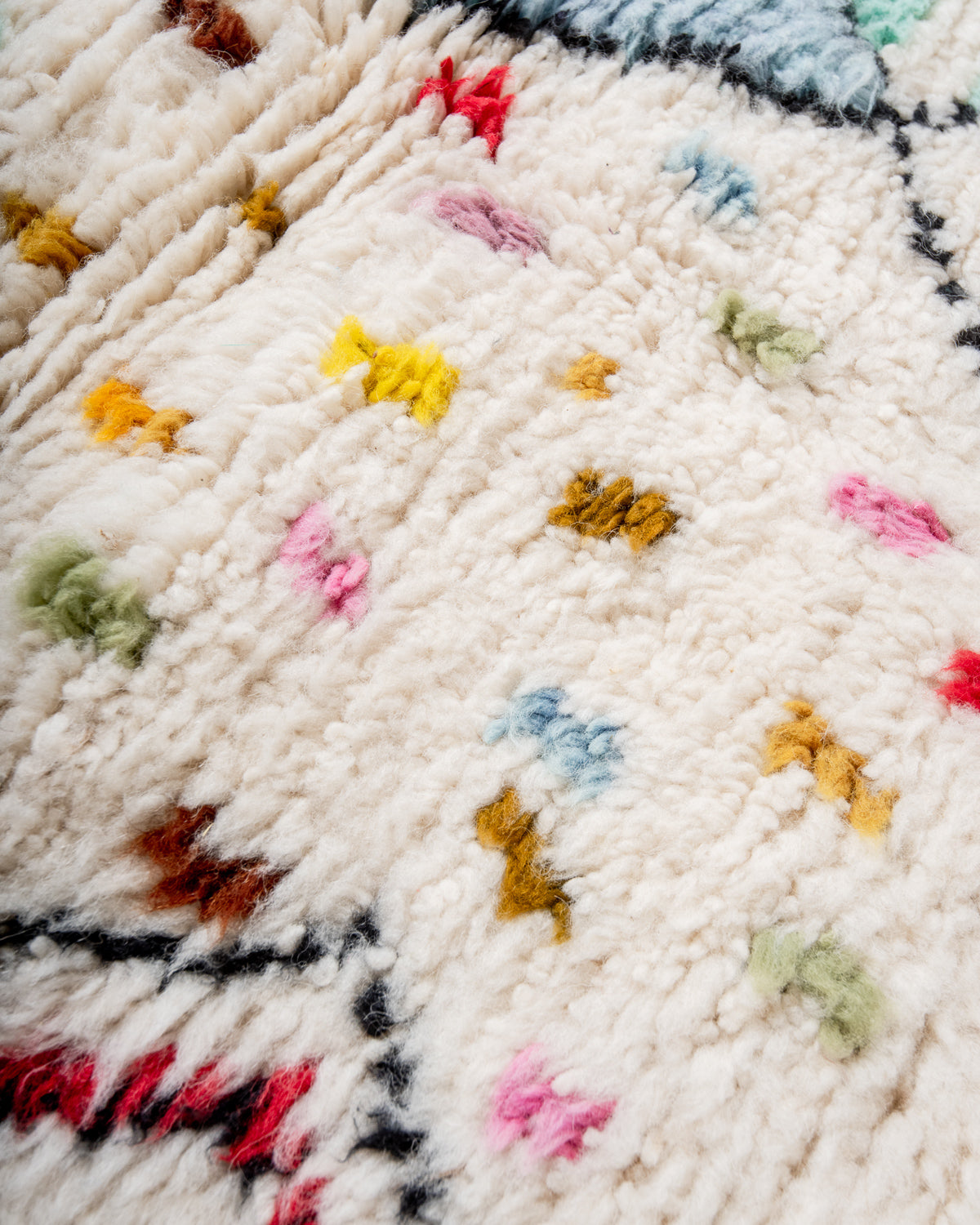 Modern, designer, handcrafted Berber rug from Morocco. Beniourain carpet with beautiful colours and patterns and fluffy wool texture.